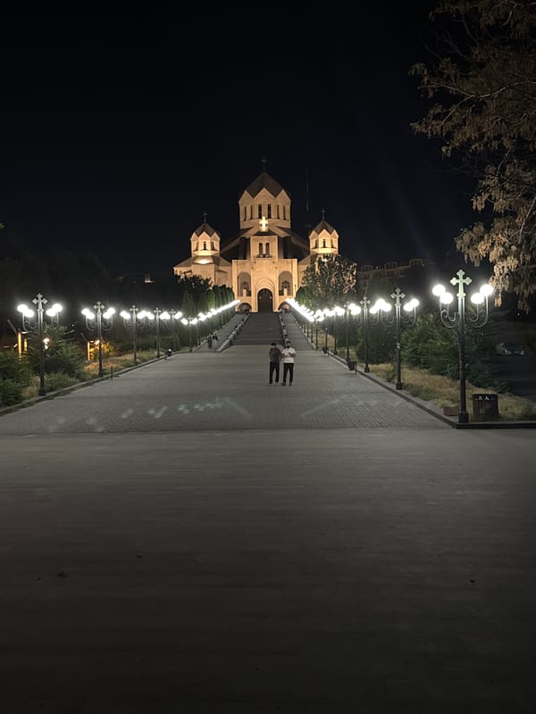 Yerevan landmarks at night: cathedral and equestrian monument