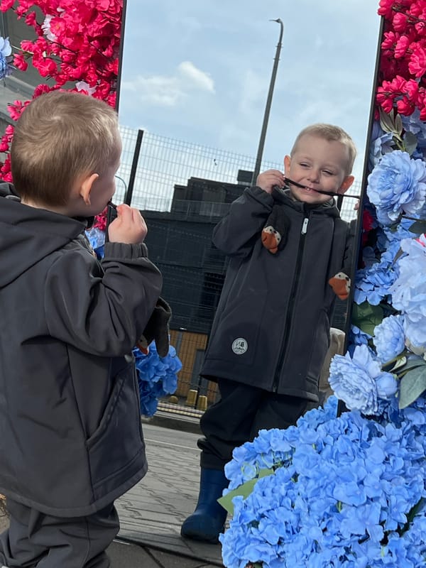 Child plays at decorated mirror in Mytishchi