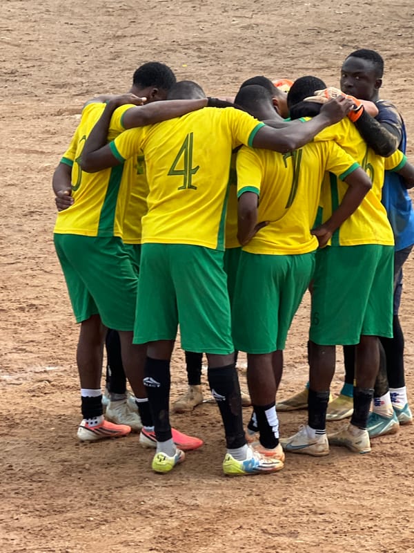 Football in full swing on a dusty pitch in Jos, Nigeria.