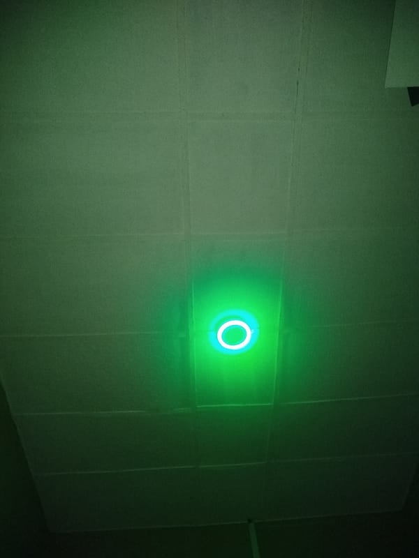 iPhone UI screens and a ceiling light, nothing more.