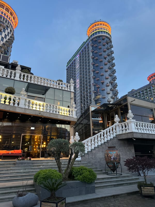 Evening stroll captures Batumi skyline, waterfront, and partial eclipse