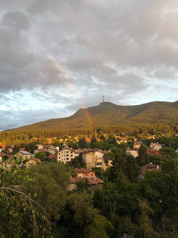 Sofia hillside views with Vitosha backdrop and a rainbow