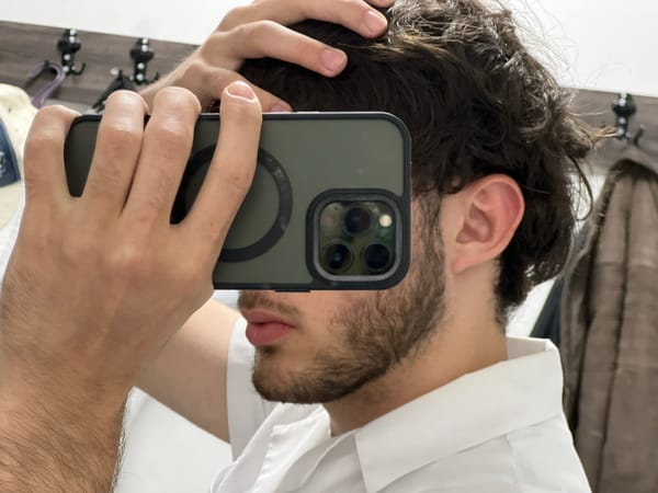Man takes mirror selfie with iPhone in Yerevan