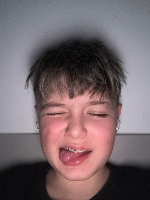 Young person poses playfully with tongue out in Sofia