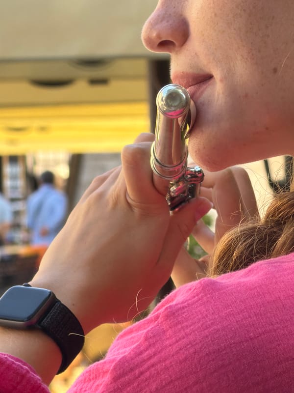 Street musician plays flute in Budva's old town