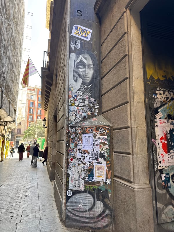 Tourist documents morning walk through Barcelona's Plaça de Catalunya