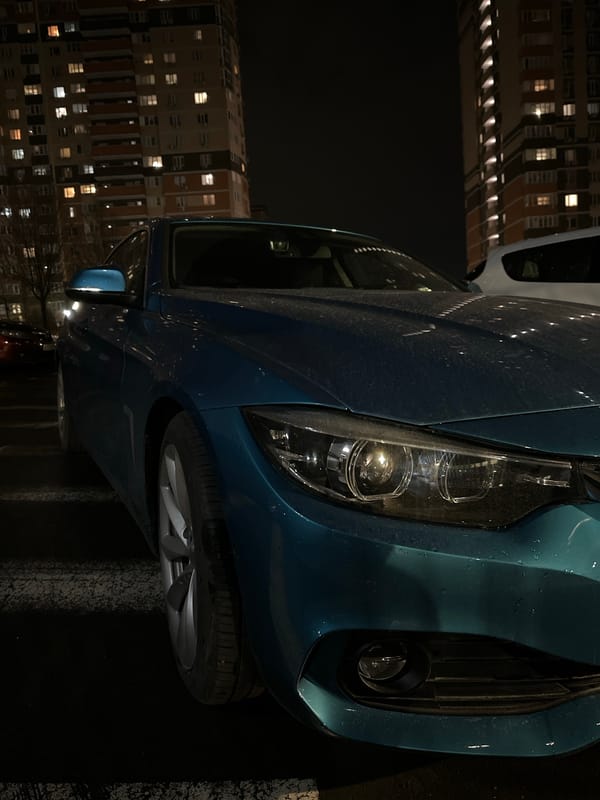 Blue car parked on street in Novoalexandrovka, Russia