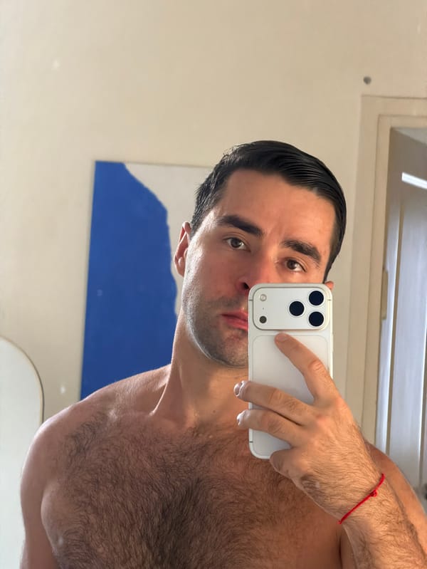 Man takes mirror selfie indoors in Tel-Aviv