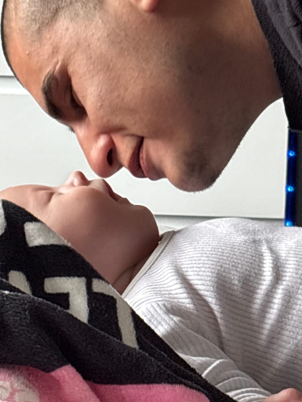 Tender moment between man and baby documented in Carlisle
