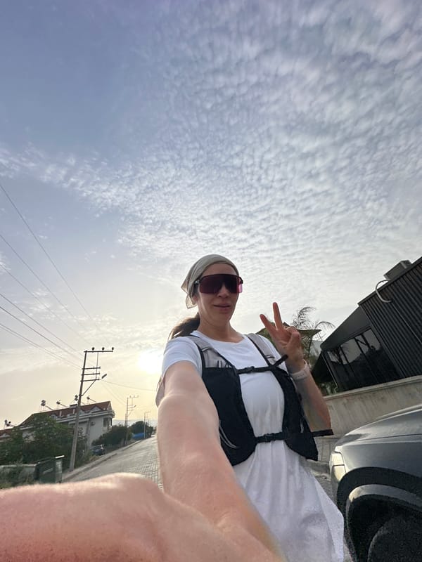 Woman takes selfie with peace sign in Fethiye, Turkey