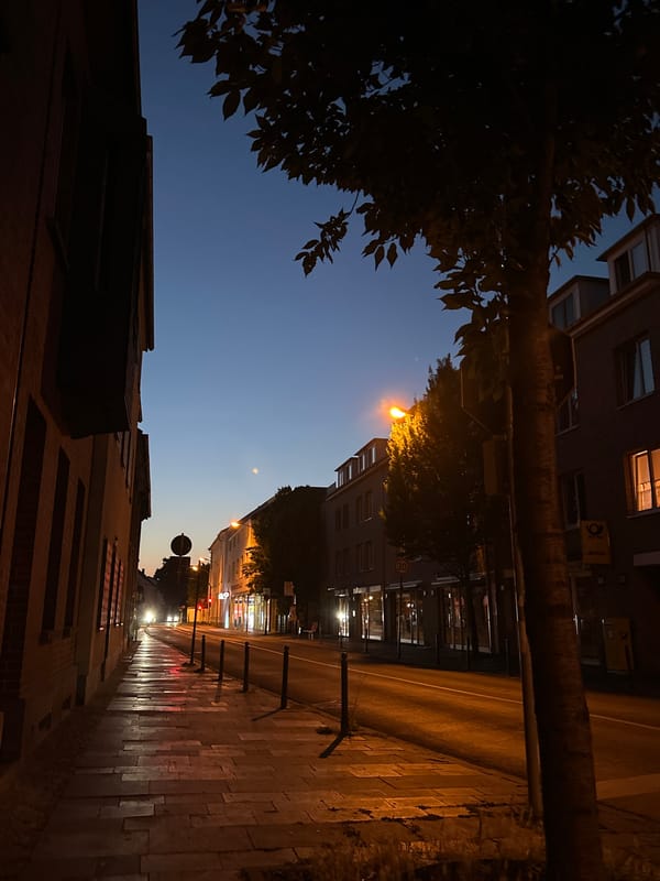 Krefeld at dusk: streets, a church tower, and street-level details