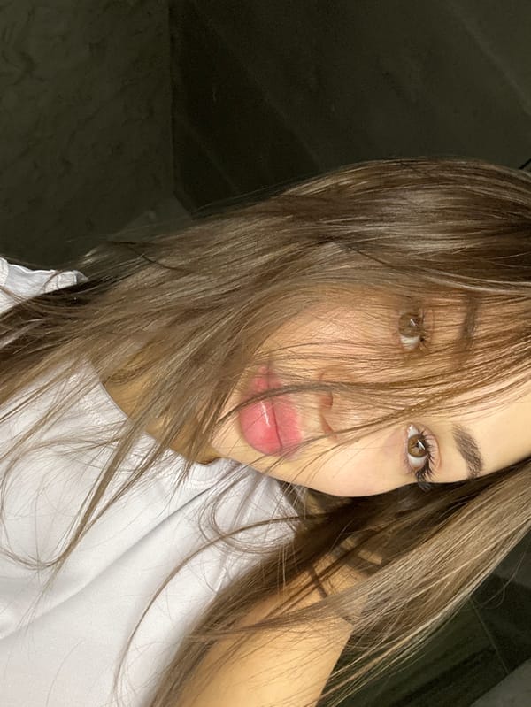 Woman documents evening with selfies and cat in Pervomaysky