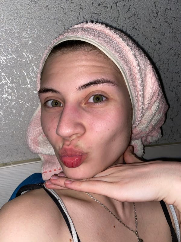 Domestic moments captured: woman with towel, cats in Votkinsk