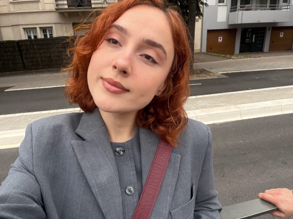 Red-haired person takes selfies in Strasbourg