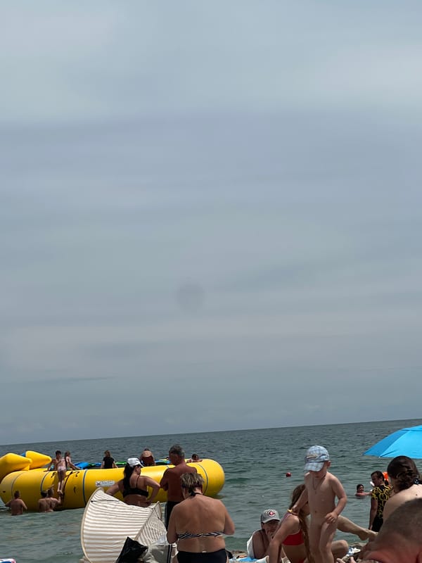 Crowded Odesa beach on a gray summer morning