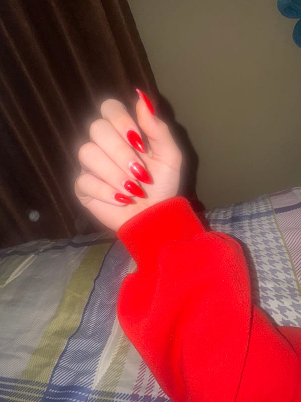 Hand with red nails photographed in Lehchevo, Bulgaria