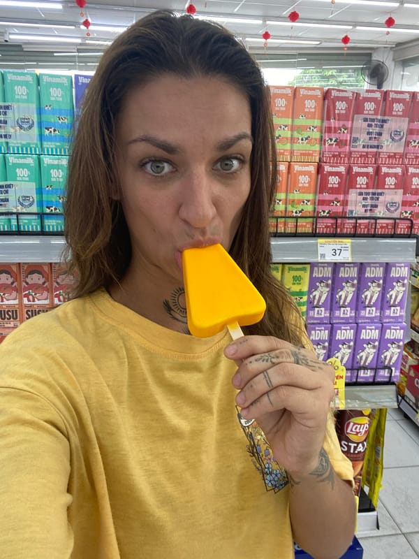 Woman samples frozen treats while shopping in Đồng Nai stores