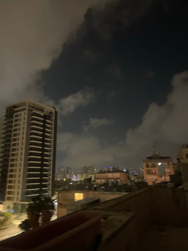 Petah Tikva resident documents nighttime cityscape and late dinner
