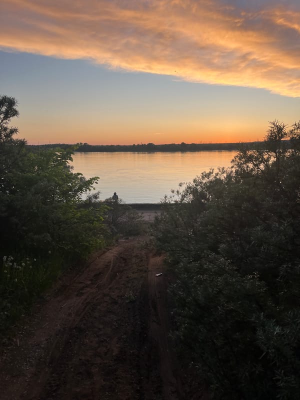Golden hour riverside scene captured in Chaikovsky, Russia