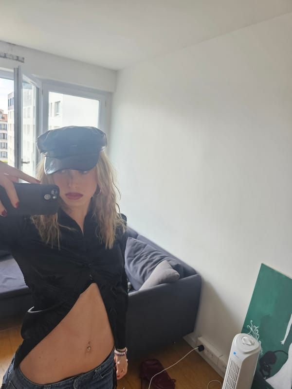 Woman takes selfies indoors in Pantin residential setting