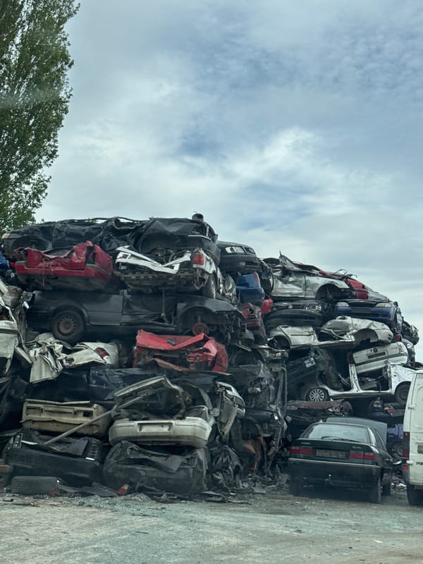 Scrapyard operations documented in Varna, Bulgaria with hydraulic cranes
