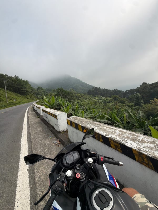 Motorcycle parked on foggy Hai Van Pass near Đà Nẵng