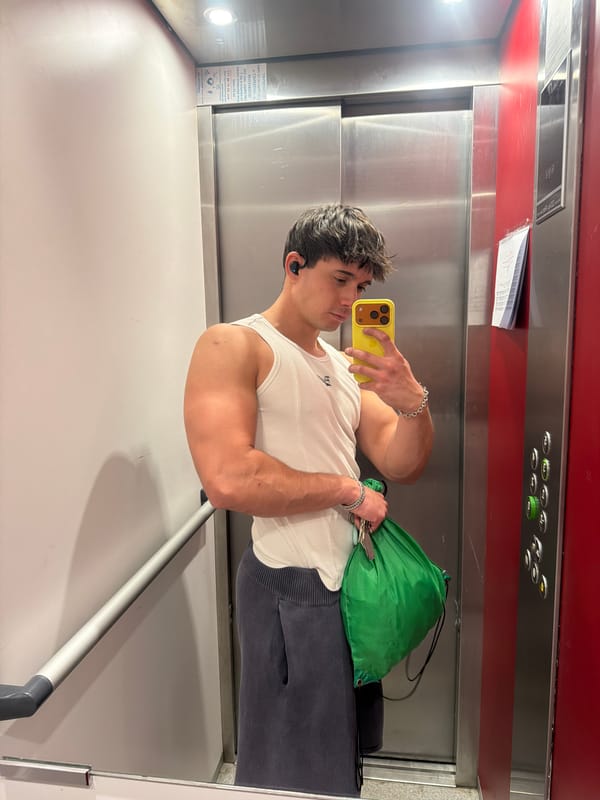 Young man takes elevator mirror selfie in Sofia