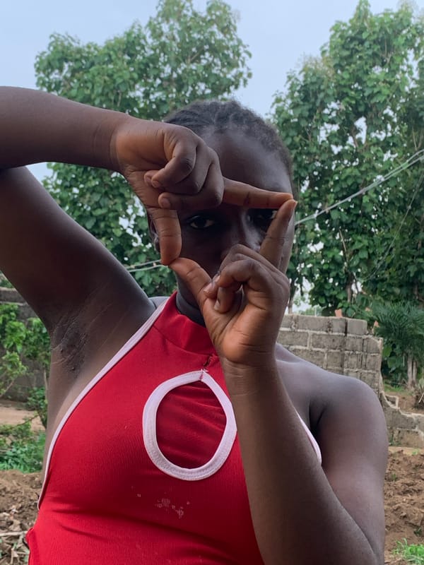 Woman poses for photos in Agban, Nigeria