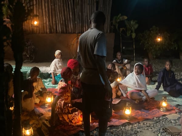 Evening Community Gathering With Oil Lamps in Barden Yana