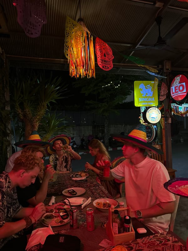 Lunch and sombreros at an outdoor spot in Ban Ao Nang