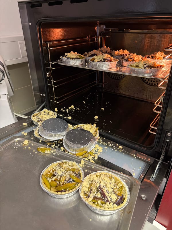 Fruit crumble tarts baking in an oven in Meisenheim