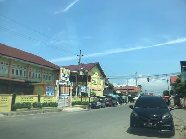 Morning street life and coffee culture in Lhokseumawe, Indonesia