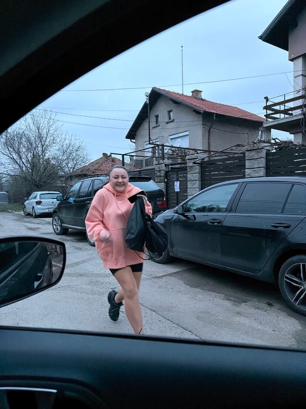 Woman poses for photo on residential street in Dragichevo