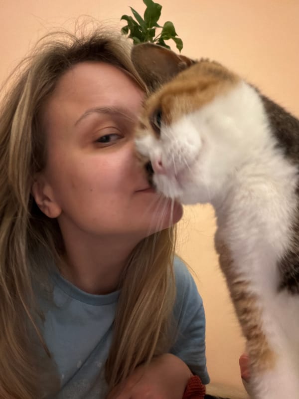 Woman shares tender moments with calico cat in Tel Aviv