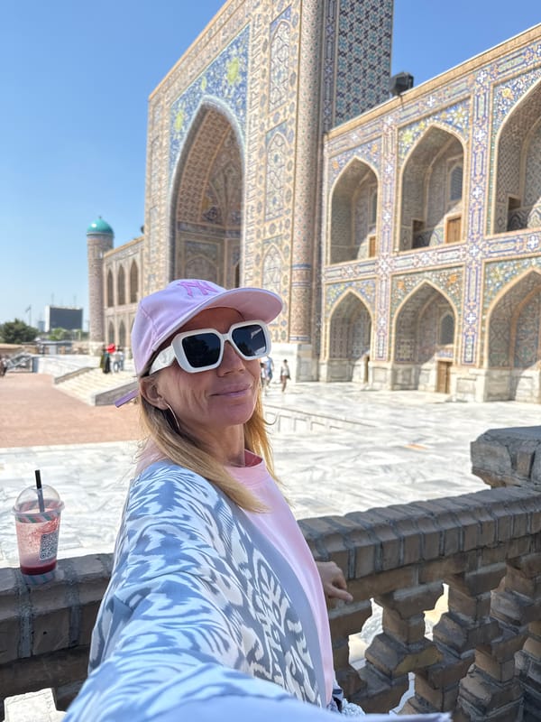 Tourist documents historic Samarkand sites and urban farm animals