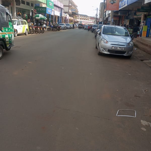 Silver Mitsubishi parked on street in Sheywe ward, Kenya