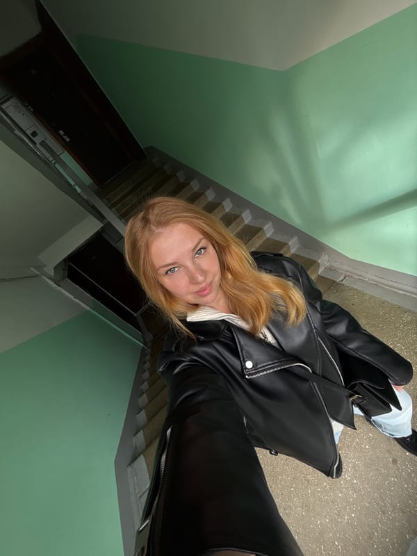 Person photographed twice in different outfits in Podosenikha building