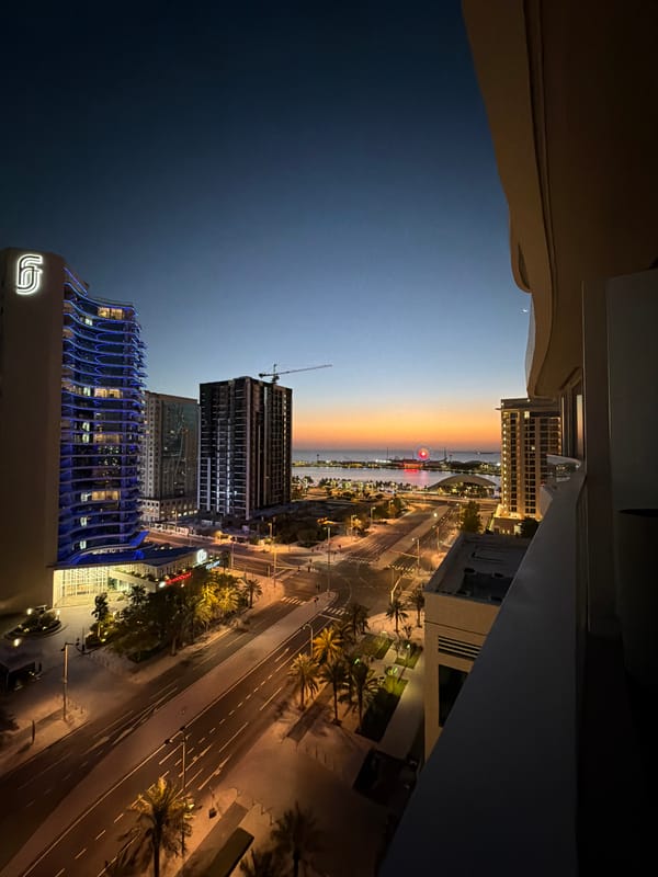 Witness documents illuminated waterfront city during dusk hours