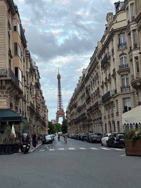 Parisian street view with Eiffel Tower captured Sunday evening