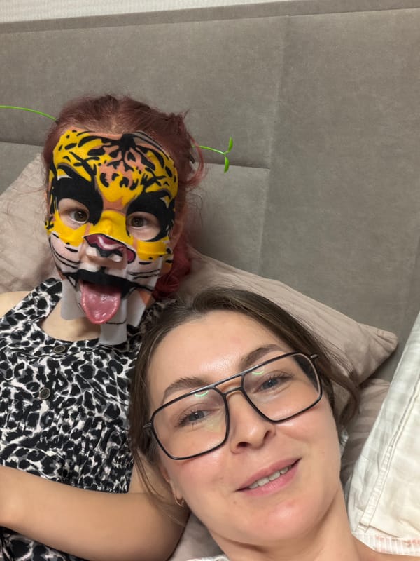 Family playful moment with animal masks in Markovo