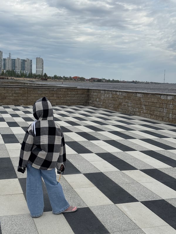 Person observes waterfront from embankment in Nizhnevartovsk, Russia