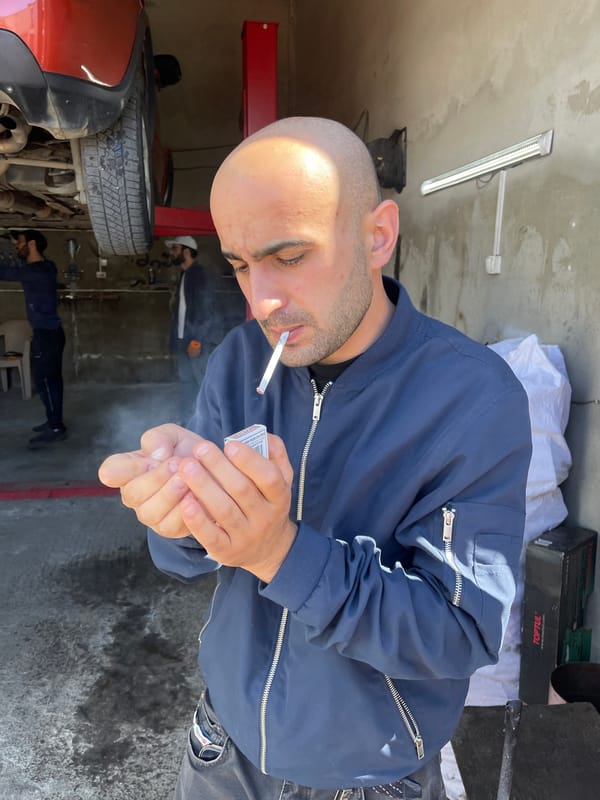Auto repair work documented at Tbilisi garage facility
