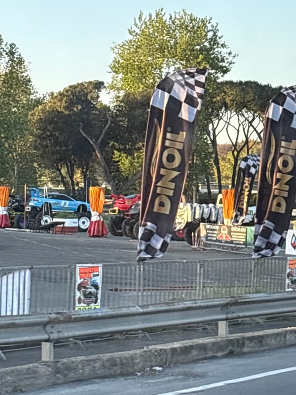 Motorsports event setup with checkered flags observed in Rome