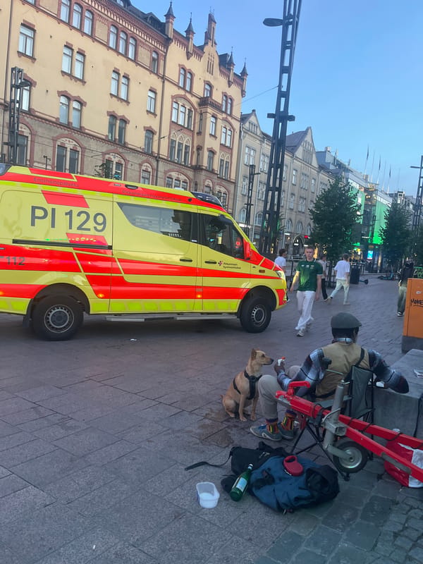 Ambulance responds near Tampere Market Square, July evening