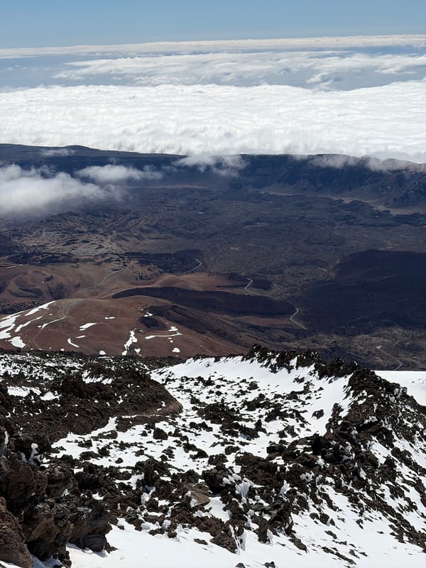 Tourist photographs Mount Teide volcanic landscape from high altitude