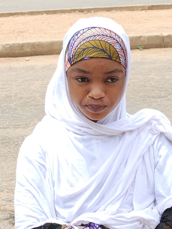 Two portrait-style moments from Jos, Nigeria