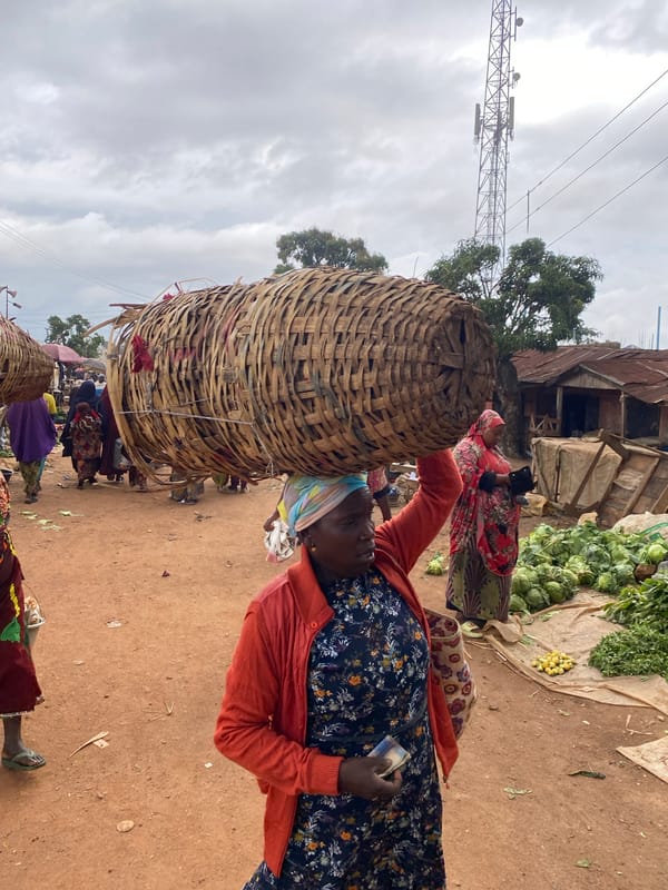 Midday street life and market activity in Bukuru, Nigeria