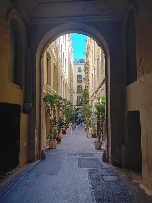 Barcelona archway frames narrow street view