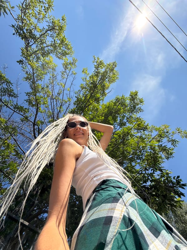 Sunny summer portraits among green trees in Rusanovo