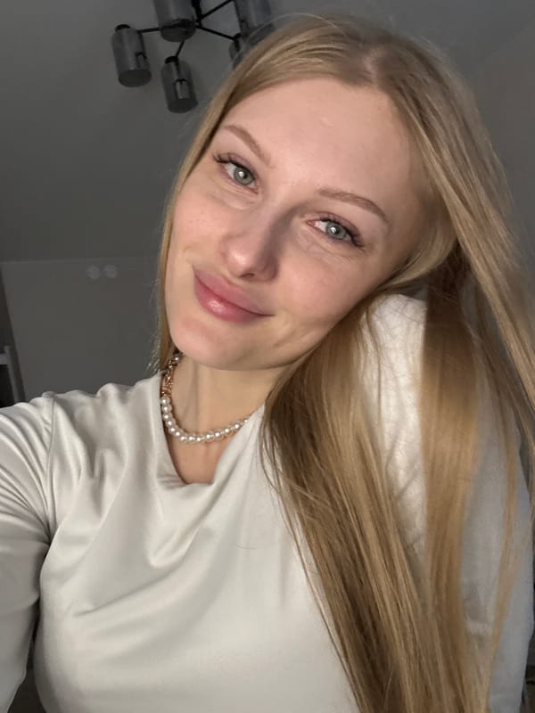 Woman takes selfies during afternoon photo session in Perm